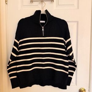 Black and white striped Zara half-zip knit sweater.